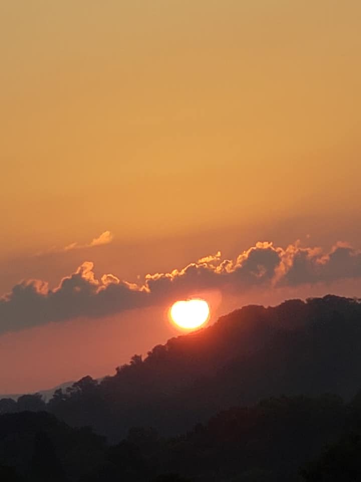 Sun Going Behind the Clouds